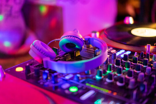 Headphones on illuminated mixing board