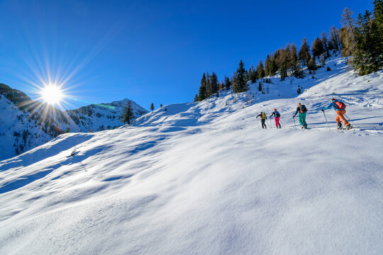 Austria, Tyrol, Group of skiers traveling in row across Grosser Galtenberg