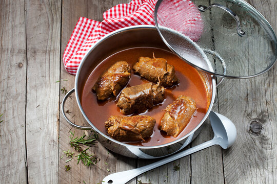 Beef roulades with sauce in stew pot