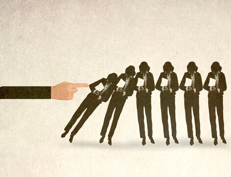 Illustration of oversized hand toppling line of businesswomen