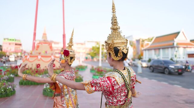 Traditional Thai Khon Dancers Performing in Front of a Temple