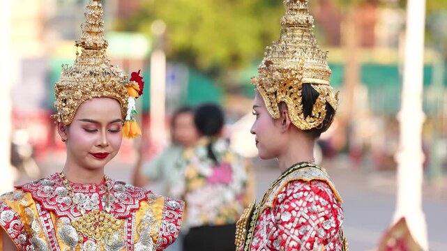 Traditional Thai Khon Dancers in Ornate Gold Costumes and Headdresses