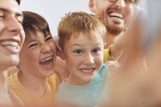 Father and sons having fun at home