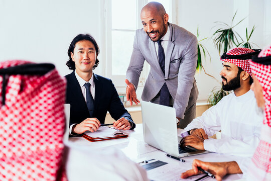 International executives collaborating during an office meeting