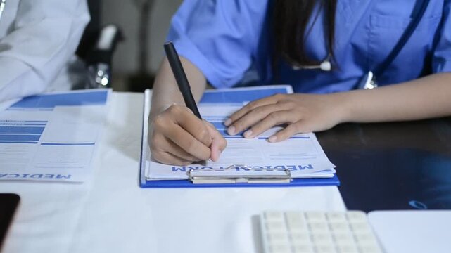Multiracial doctors team advising about the treatment of patient using x-ray scan during meeting in office clinicMultiracial doctors team 