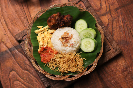 Steaming rice sits center, topped with crispy fried shallots
