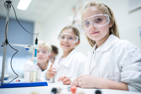 Students in a science class conducting experiments to learn and explore scientific concepts
