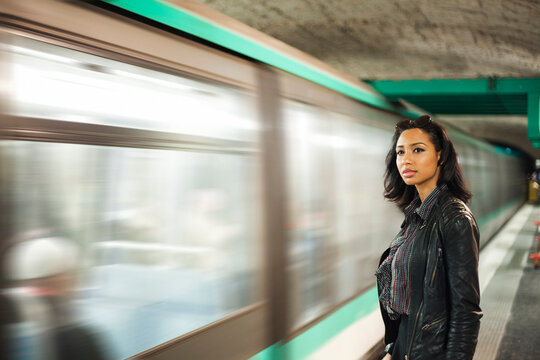 France, Paris, young woman at underground station