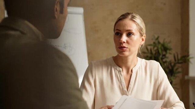 Engaging Discussion Between Two Professionals in an Office Setting Focused on Insightful Ideas and Solutions Captured in a Collaborative Environment