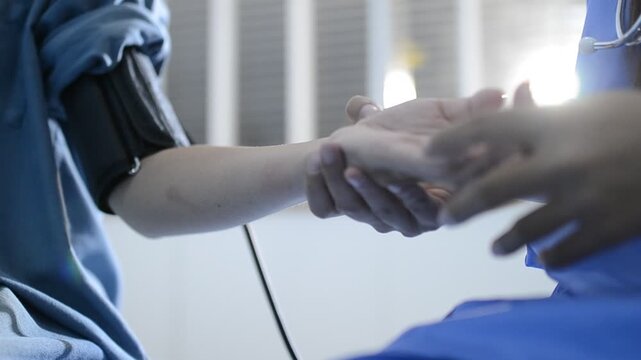 The doctor measures blood pressure to the patient