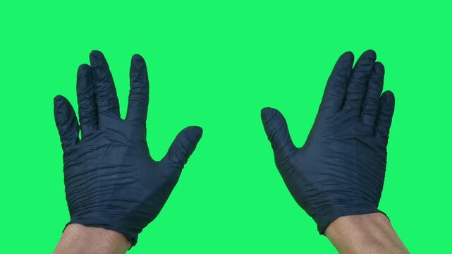Close-up of both hands waving against a green screen background. Perfect for chroma key editing, greetings, welcoming scenes, motion graphics, advertising, presentations, and visual effects