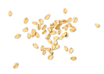 Scattered oat flakes on a clean white background.  Top view of oat flakes isolated. © Tatyana Sidyukova