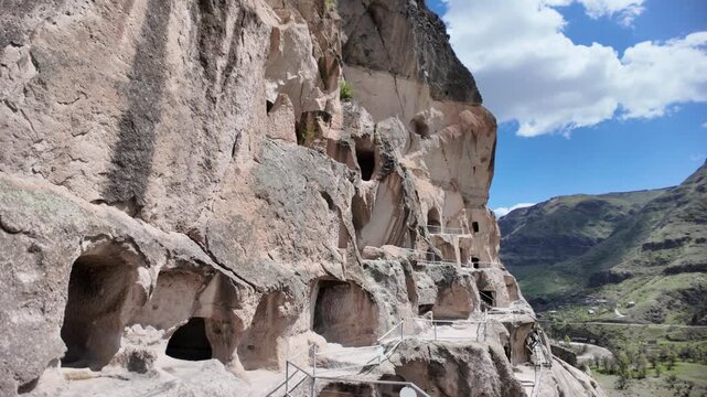 Stone stairs leading up to Vardzia cave monastery carved into Erusheti Mountain cliffs in Georgia, a historical 12th-century medieval landmark