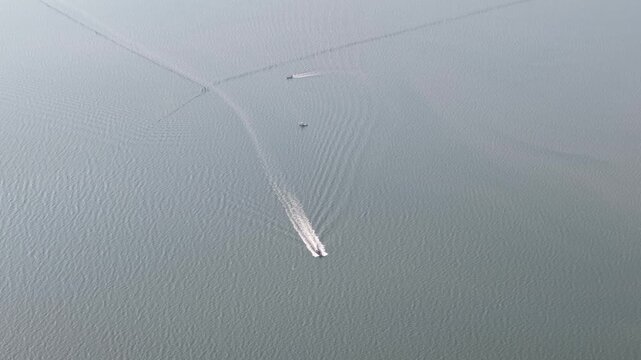 Aerial view of boat moving across Kuala Gula sea