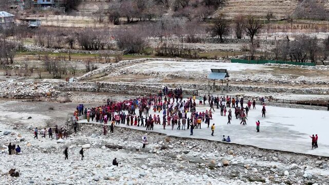 Scenic Aerial View of Traditional Pahadi Dance Celebration During Sangla Holi Festival with Local People Wearing Colorful Traditional Clothes, Himalayan Village Culture, Festive Gathering, Kinnaur Val