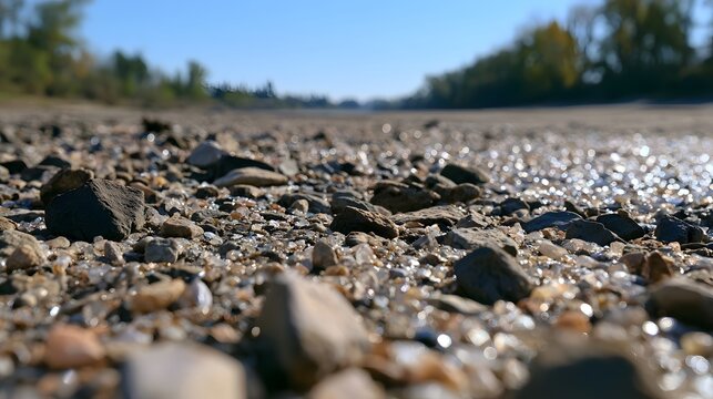 A medium shot of a parched riverbed expanse featuring sparkling reflections and smooth gradients that convey warmth and comfort