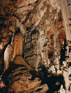 Brown stalactites hanging from cave, Coves de Campanet, Mallorca, Spain