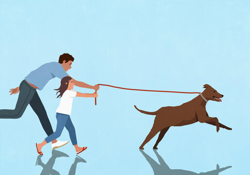 Father and daughter trying to keep up with energetic dog running and pulling on blue background