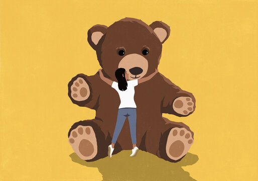 Woman hugging large teddy bear