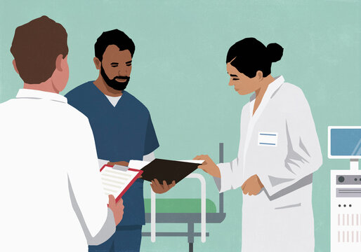 Doctors and nurse discussing medical chart in hospital room