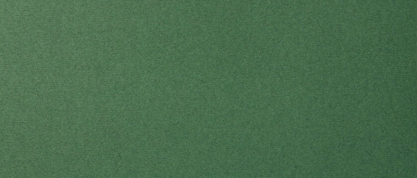 Green textured paper background with natural grain for design templates