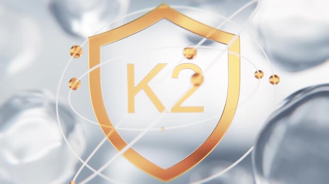 Menaquinone Vitamin K2 golden shield symbol in 3D animation. Calcium metabolism and bone health molecular structure background with transparent liquid cells for medical video