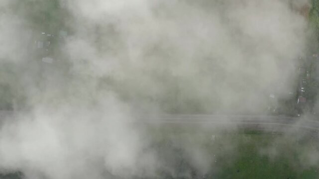 The drone flies through clouds of smoke. Dangerously poor air quality.