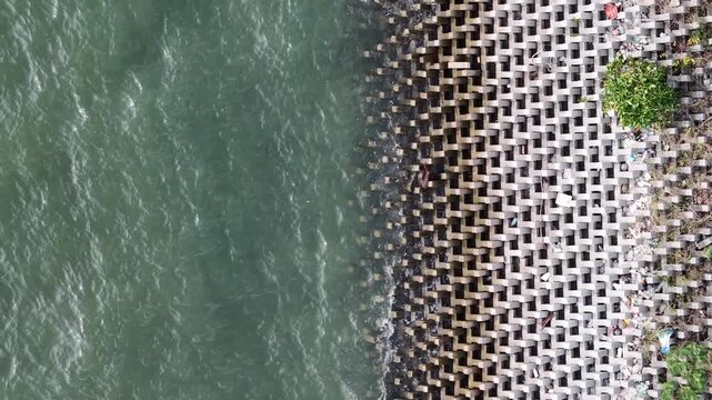Aerial drone view of interlocking barrier at Ban Pecah coast