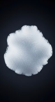 Thick, dense, white soap foam structure floating in isolation against a dark, featureless background, showing detailed bubbling texture, airy, pure, structure