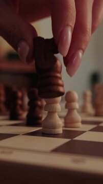 Making a Strategic Chess Move on a Wooden Board