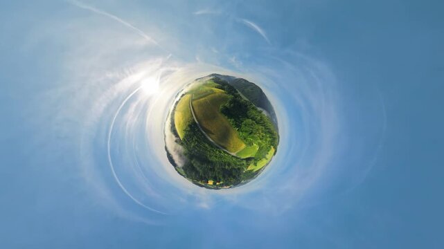 Drone footage above the M&uuml;hlviertel and Danube Valley in Upper Austria. The video transitions into a tiny planet effect before smoothly returning to a natural aerial perspective.