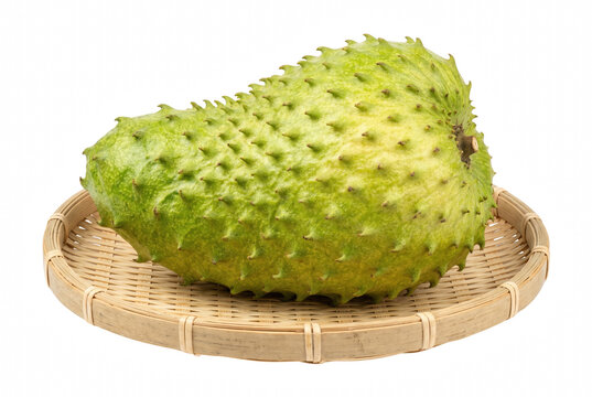 Fresh Whole Soursop Fruit Resting On A Woven Bamboo Tray