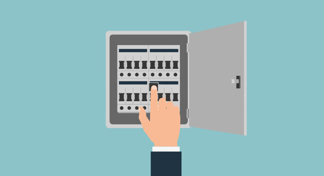 Hand adjusting electrical circuit breaker panel switches carefully.