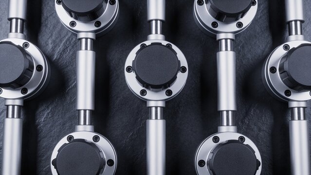 Precision optical bench vibration isolator modules on dark background