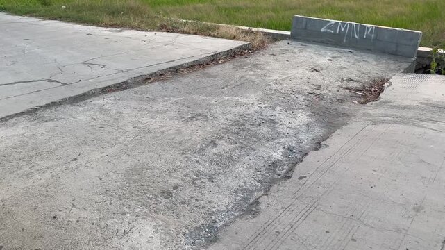 Old concrete culvert infrastructure with graffiti in rural area
