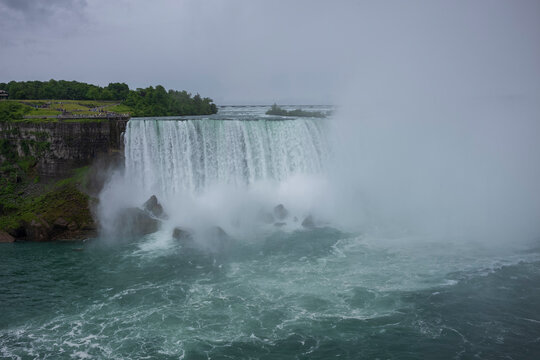 Tourist explore on a boat the famous Niagara Falls