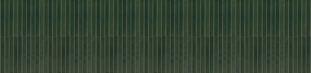 Vertical deep olive green ceramic mosaic strip tiles arranged in a stacked wall pattern © EdisonArt