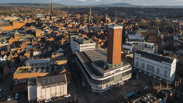 Aerial Drone View of Shrewsbury Residential Neighbourhood and market hall building on a sunny Day, England