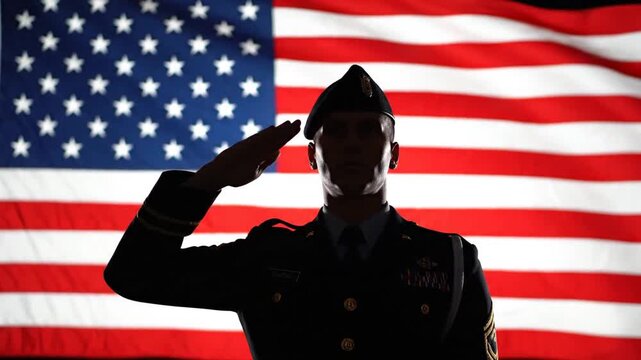 Silhouette of a soldier in uniform saluting with the American flag in the background.