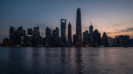 Fototapeta premium Modern city skyline with tall buildings reflecting on calm river water at dusk in urban setting