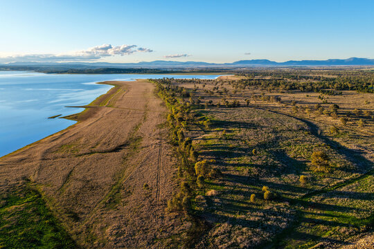 Aerial scene showcasing Lake Keepit and the surrounding rural landscape, highlighting the expansive reservoir, natural shoreline and peaceful countryside in NSW, Australia.