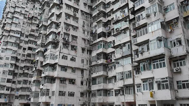 The Monster Building is a complex of five interconnected residential blocks in Quarry Bay, Hong Kong. Known for its dense urban, facade is filled with air conditioners, drying laundry.