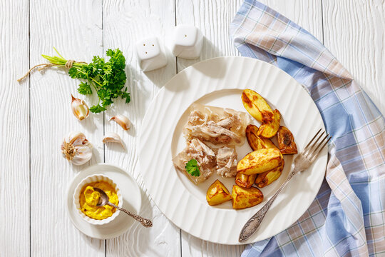 Cold meat aspic plate with crispy potatoes