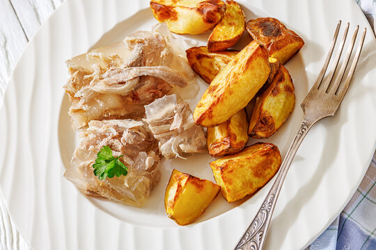 Cold meat aspic plate with crispy potatoes