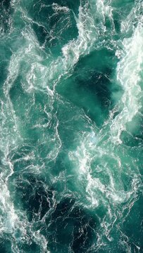 Blue waves of water of the river and the sea meet each other during high tide and low tide.
