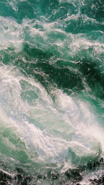 Blue waves of water of the river and the sea meet each other during high tide and low tide.