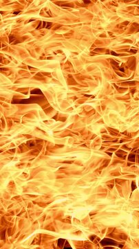 Vertical video Abstract orange fire flames background texture.