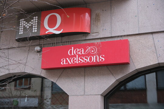 Eskilstuna, Sweden-Nov.27th 2025: brand signboards of MQ and dea axelssons on a building facade in Eskilstuna, Sweden.