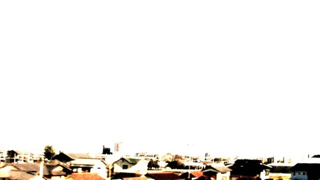 走る電車の窓から見える住宅街