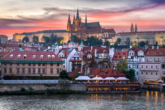 Colorful sunset over Prague Castle and Vltava River